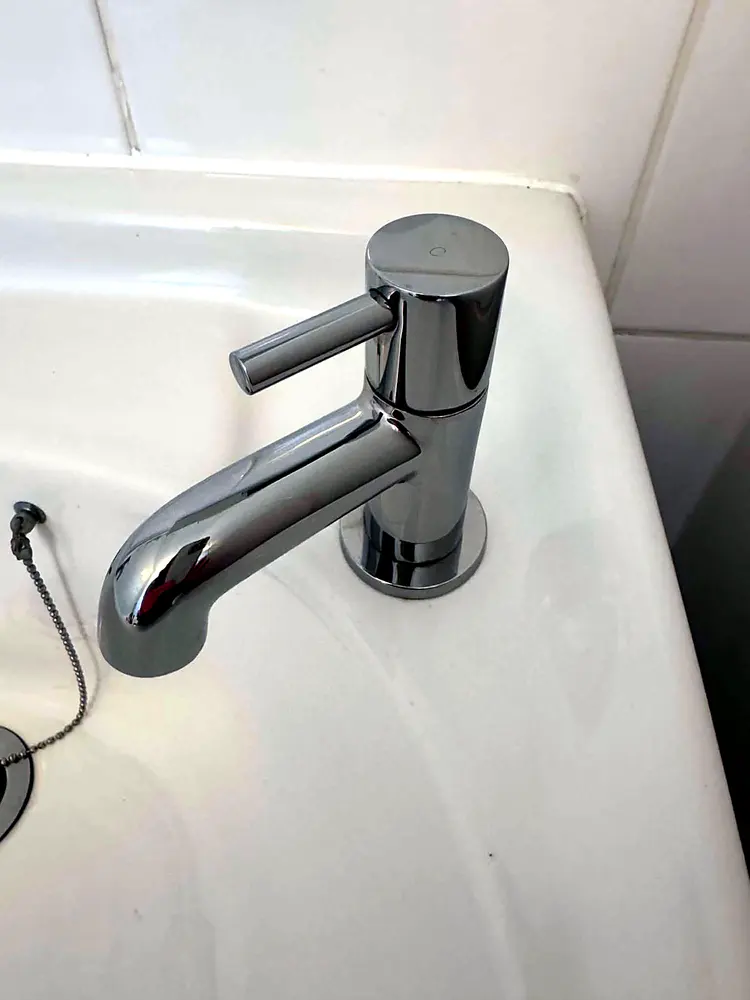 The same tap polished to a spotless mirror shine